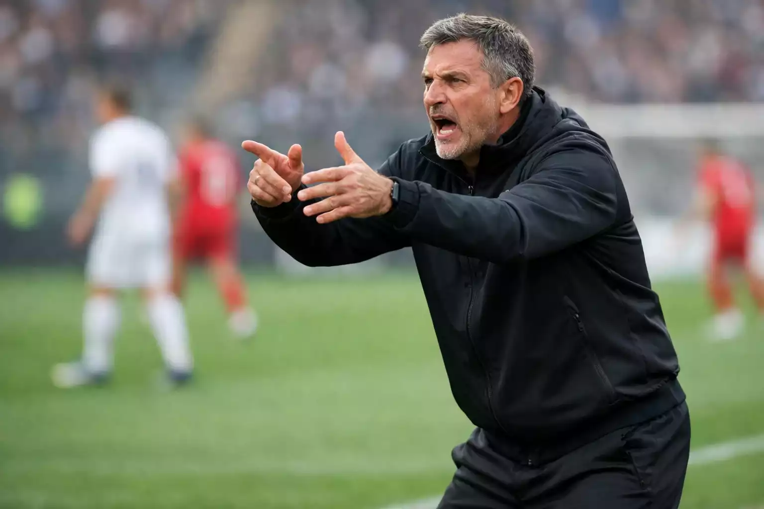 Voetbalcoach geeft tactische aanwijzingen langs de lijn